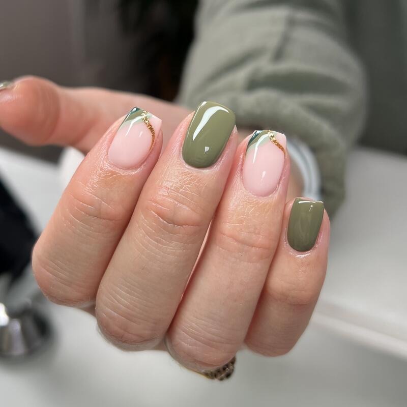Olive green nails with leaf-tip nude accents